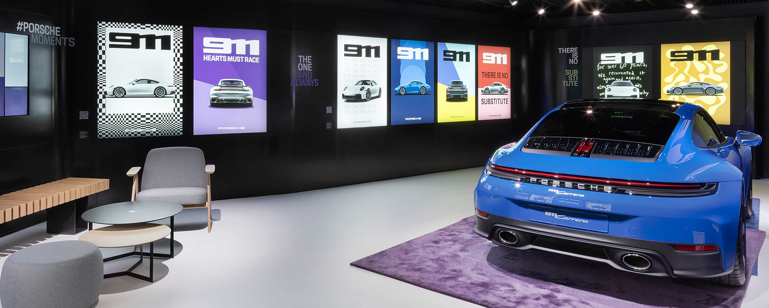 A person scans a QR code on a screen using their smartphone to download an application.